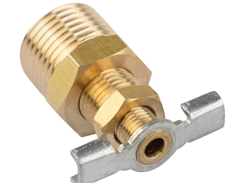 Plumber installing a brass drain valve in an Old Town Scottsdale AZ water heater