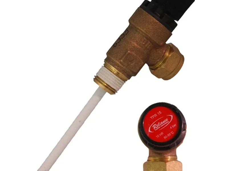Technician replacing the gas control valve on a water heater in Gilbert, AZ