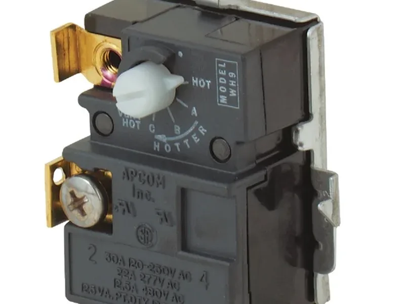 Technician testing water heater thermostats with a multimeter in Queen Creek, AZ 85142