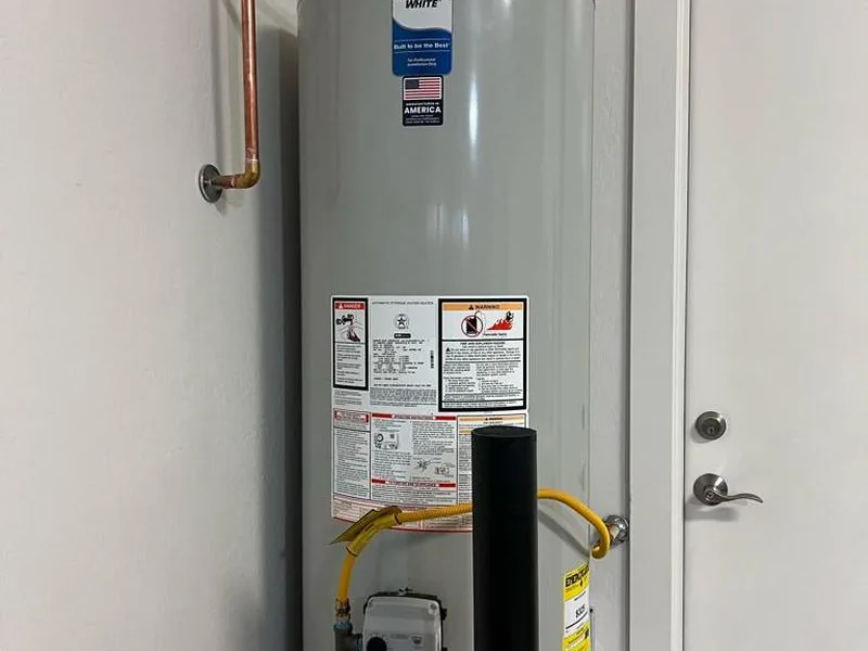 New aluminum drain pan installed under a tank water heater in a Maricopa home