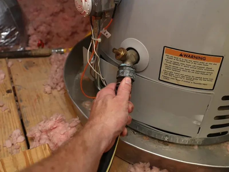 Water heater sitting centered in a properly sized drain pan in a Scottsdale attic